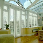 White upvc T-shaped Conservatory by Adam Window Centres, Tuckton